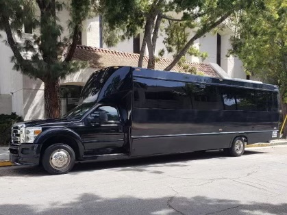 A black limo parked on the side of the street.